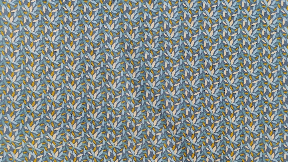 Bomuldsstof blå med blade i carry og lys blå - Oeko-TEX