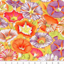 Variegated Morning Glory orange er en stof med motiver af snerler i forskelle klare farver med bundfarven gul.